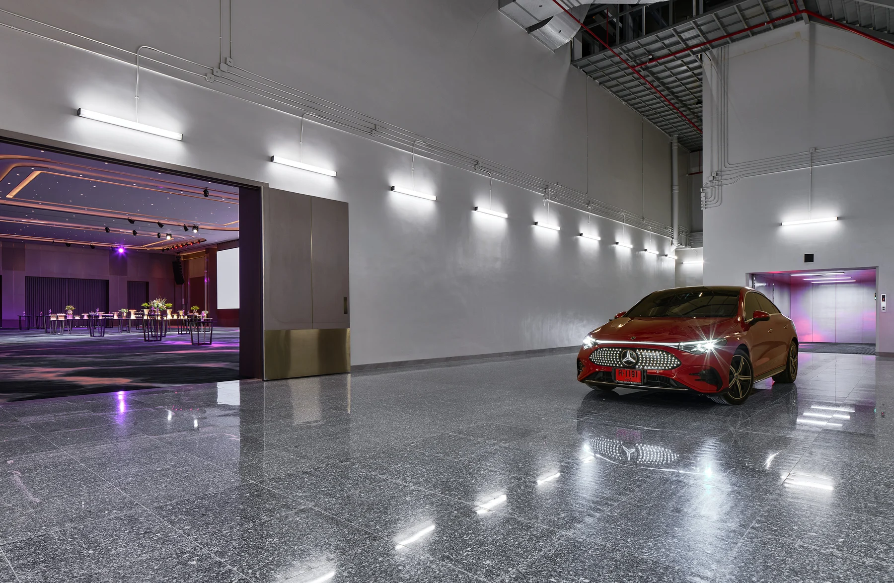 Vehicle elevator delivering a car directly into the meeting room at Halo Hall